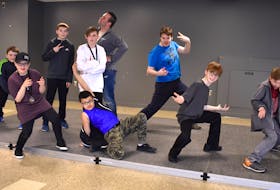 The boys of Cape Breton dance strike a pose in the community room at the Emera Centre Northside during a break at the Danceabition competition on Sunday. In front, from left, are Jacob MacKinnon, 12, Drayas Darling, 9, Ryan Davis, 12, and Landon Hubley, 12. In back, from left, are Tanner MacDonald, 10, Connor MacDonald, 13, Cole MacNeil, 13, Kyle Hunter, 29, and Michael Cox, 18.