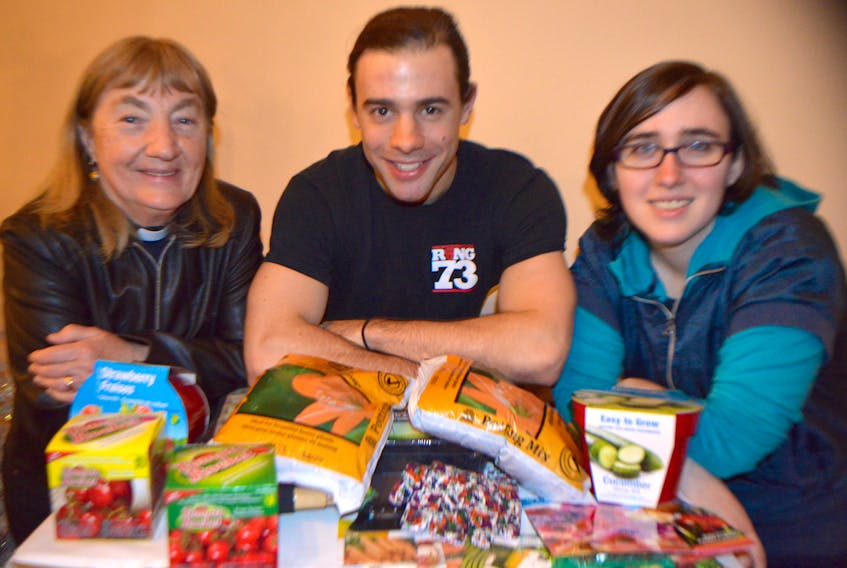 Steven MacNeil, centre, vice-chair of the New Aberdeen Revitalization Society, shows some of the items already donated for Buddy’s Garden, a community garden the society is starting at Victoria Haven Nursing Home in Glace Bay. Also shown are Rev. Marian Lucas-Jefferies, left, of Collieries Parish and Emily Angelo of Glace Bay. Lucas-Jefferies and Angelo are two of several community partners who jumped aboard to help. The garden is being named after Angelo’s late grandfather Arthur (Buddy) Payne, who loved to garden.