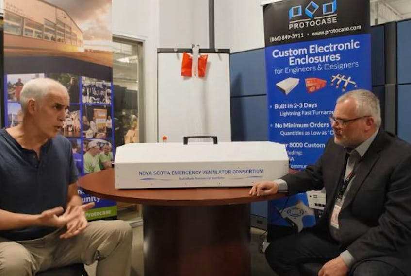 Doug Milburn, left, talks with Joe Menchefski from 45 Drives about the Nova Scotia Ventilator Project in this screen grab from a YouTube video explaining the project.