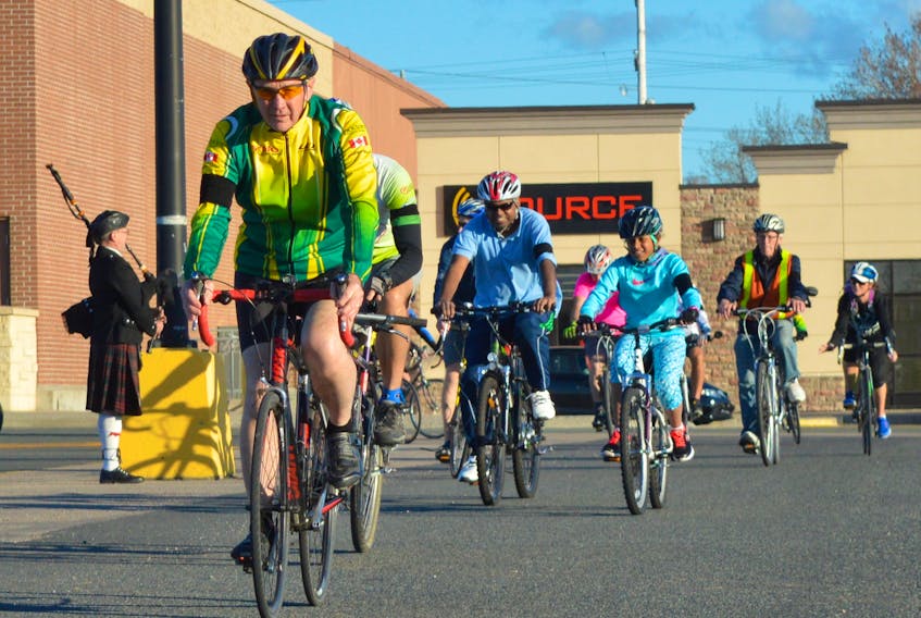 In this file photo, Vic Gouthro leads a group of cyclists through the parking lot of the Sydney Shopping Centre at the start of last year’s Ride of Silence. The silent ride allows participants to remember cyclists killed or injured by motor vehicles while raising awareness about sharing the road and bicycle safety. This year’s ride is set for this evening. Participants are asked to meet at the Sydney Shopping Centre at 6:30 p.m.