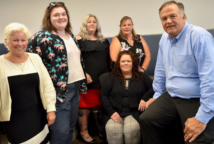 The newly hired staff of FlannelJax’s Customer Care Centre were all smiles Monday just before the grand opening of the Sydney facility. Shown here left to right standing are, Kate Wills, Allison MacLeod, Brenda Lamson and Heidi Fliegel and sitting are Susan Grant and Andrew Arminem, Metal Supermarkets Family of Companies’ vice president of franchising for FlannelJax.