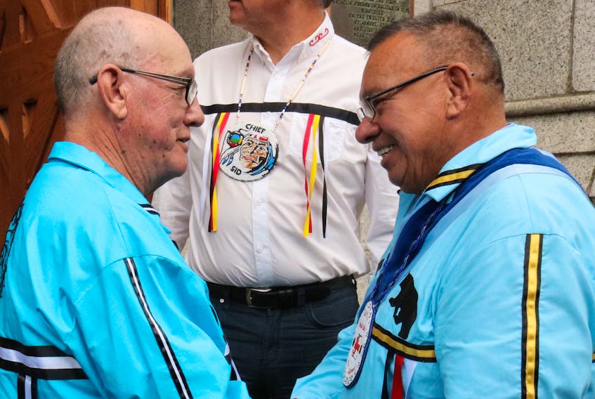 Membertou's Chief Terry Paul shakes hands with our new Kji Saqmaw, or Grand Chief, or the Mi'kmaq Grand Council Norman Sylliboy.