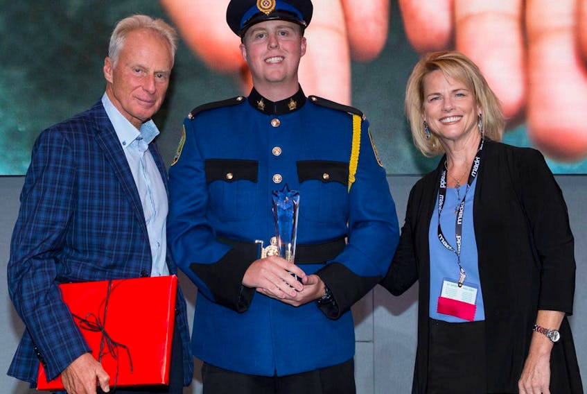 Cape Breton Regional Police Service Const. Brennan Burrows, centre, receives the Terry Ryan Memorial Award for Excellence in Police Services from MADD Canada CEO Andrew Murie and national board of directors chair Susan Steer.