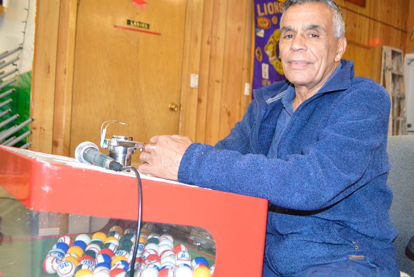 Jules Gittens, treasurer of the New Waterford Lions Club, at the bingo machine. Gittens said after more than 50 years they are still hosting bingo twice a week but now all proceeds are used to help people travelling back and forth to Halifax for medical appointments.