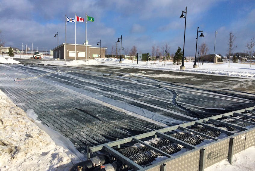 The process of converting a portion of the Open Hearth Park parking lot into a spacious outdoor skating rink began last week. The grand opening is Saturday.