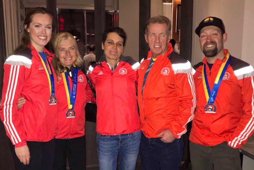A group of Cape Breton runners is shown after completing the 122nd edition of the Boston Marathon on Monday. From left are Kara MacKinnon of Westmount, Donna Burns, Carol Dakai and Gary Ross, all of Sydney, and Herbie Sakalauskas of Sydney River.