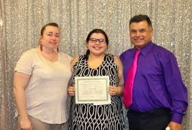 Tara Johnson, centre, with her parents Helen and Wayne Johnson. Tara contributed to a video to help raise awareness to protect her family with compromised immune systems.