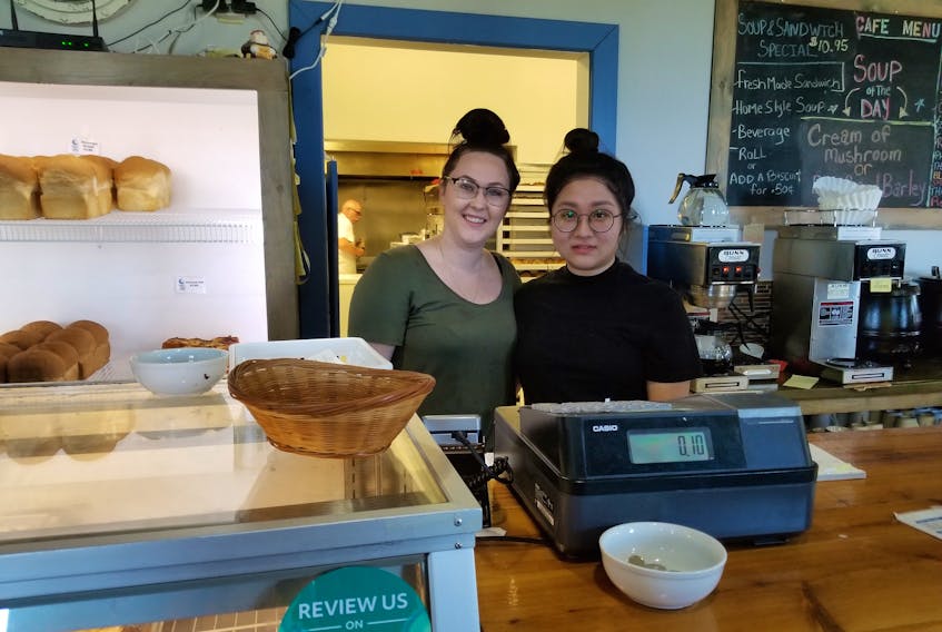 Workers for the Sweet Side Of The Moon Bakery and Cafe on McKeen Street in Glace Bay, Taylor MacNeil, and Olivia Lu, help customers as they come in to purchase baked goods and other treats. Both have been employed at the bakery and cafe for the past four months.