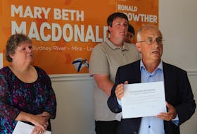 Nova Scotia NDP Leader Gary Burrill, centre, was in North Sydney Friday where byelection candidates Mary Beth MacDonald in Sydney River-Mira-Louisbourg, left, and Ronald Crowther in Northside-Westmount, signed a declaration pledging to work to keep community hospitals in North Sydney and New Waterford open. The hospitals have been slated for closure by Stephen McNeil's Liberal government, to be replaced by community health centres without emergency departments.