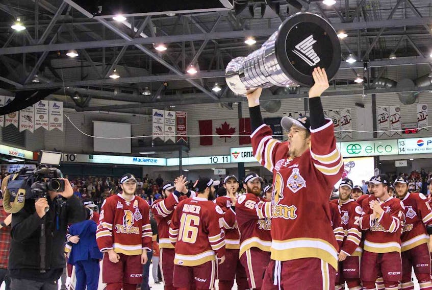 Mitchell Balmas of Sydney lifts the Quebec Major Junior Hockey League’s President Cup over his head following the Acadie-Bathurst Titan 2-1 victory over the Blainville-Boisbriand Armada in Game 6 of the league’s championship series in Bathurst, N.B., on Sunday. Balmas and the Titan will play in the MasterCard Memorial Cup, which starts today in Regina, Sask.