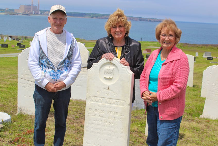 From left, Eric Spencer, Corinne Scattolon and Marg Ellsworth, members of the St. Eugene’s Cemetery committee, at the historical grave section of the burial site. They are hoping to get donations to help cover costs of maintenance, which is a struggle for the committee.