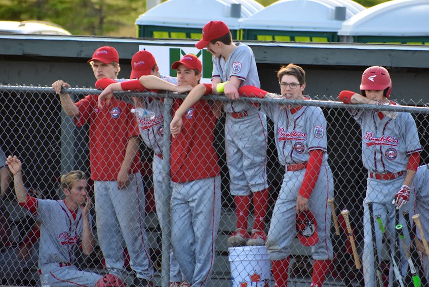 Members of the Cape Breton Ramblers are shown watching the team’s game against the Victoria Capitals of British Columbia from the bench at the Nicole Meaney Memorial Ball Park on Tuesday. The Ramblers will play the Confederation Park Trappers of Edmonton in the Canadian Senior Little League Championship semifinal on Friday.