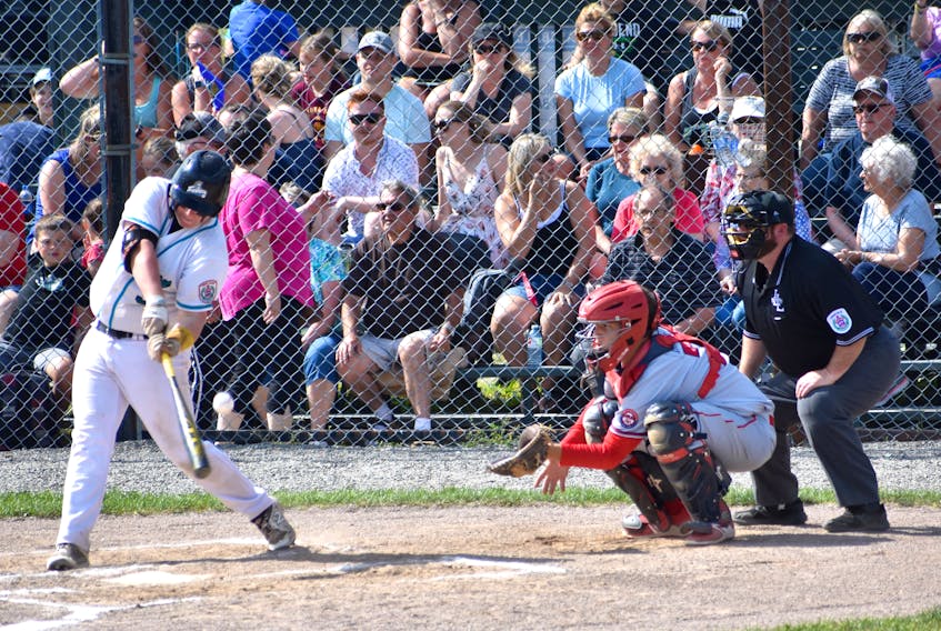 Blair Clowes of the Confederation Park Trappers of Alberta, left, fouls off a pitch as catcher Bryden Gardiner of the Cape Breton Ramblers and umpire George Long watch during Canadian Senior Little League Championship action at the Nicole Meaney Memorial Ball Park in Sydney Mines on Wednesday. The Edmonton-based team won the game 2-0.