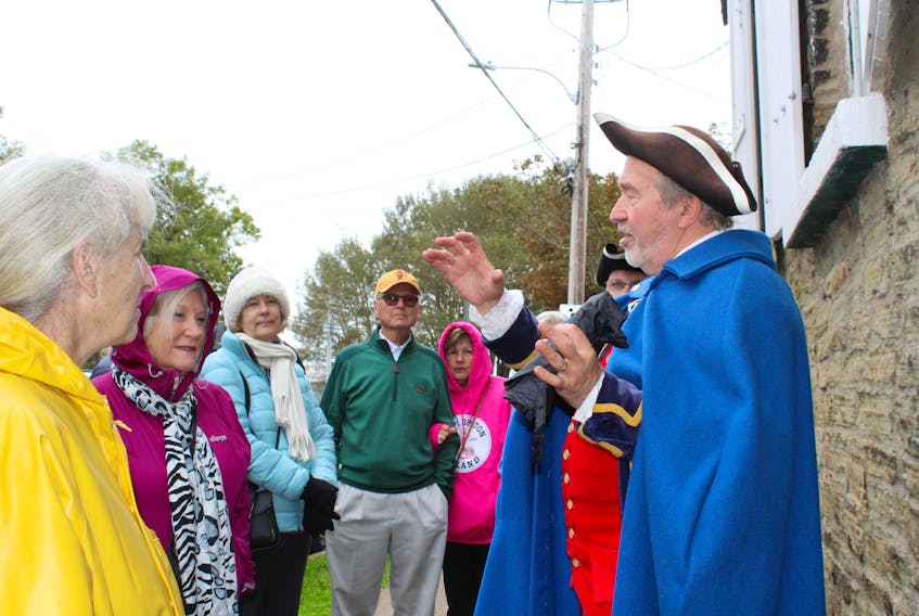 Wilfred Butler, far right, of Jost Heritage House Walking Tours, educates some cruise ship passengers on local history outside of St. Patrick’s Church Museum on Tuesday morning. Butler was leading the passengers from the Zaandam through Sydney’s historic north end with stops at landmarks such as Jost House, St. Patrick’s Church and St. Georges Church. GREG MCNEIL/CAPE BRETON POST