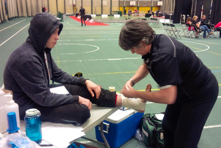 Eamonn Dudley-Chubbs of Dingwall is shown getting taped up prior to a match at the Canadian wrestling championships last weekend at the University of Alberta in Edmonton.