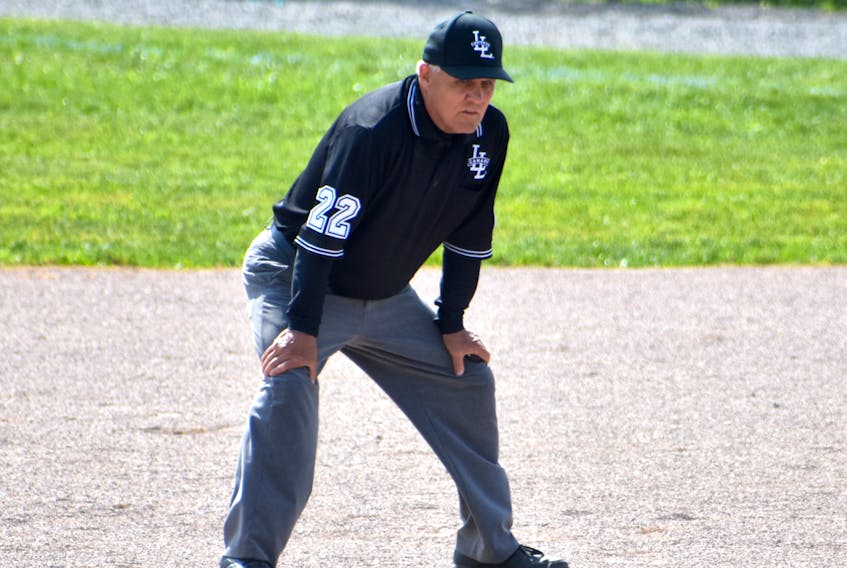 Nick Bonnar began umpiring when he was 17 years old. This summer, the Glace Bay native is celebrating his 50th season as an umpire and at the age of 67 has no plans to retire. Bonnar is shown working a Canadian Senior Little League game between the Cape Breton Ramblers and Confederation Park Trappers at the Nicole Meaney Memorial Ball Park on Wednesday. JEREMY FRASER/CAPE BRETON POST