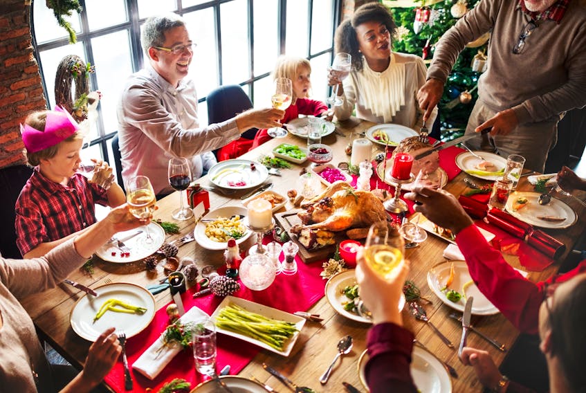 When columnist Lesley Crewe thinks about Christmas, it's just as likely to be about warring factions in Facebook land than homey scenes of Christmas dinners as shown in this stock image.