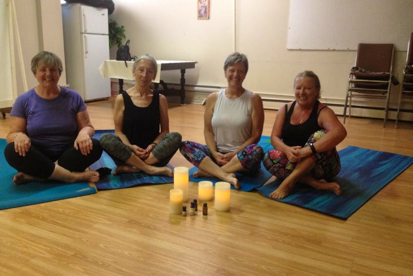 Depending on the day, anywhere from five to 15 or more participants can register for “Our Yoga” class in North Sydney. Pictured here during a recent summer session are, from left, Goritti Caldwell, Marguerite Webber, instructor Maureen Murphy and Brenda McNeil.