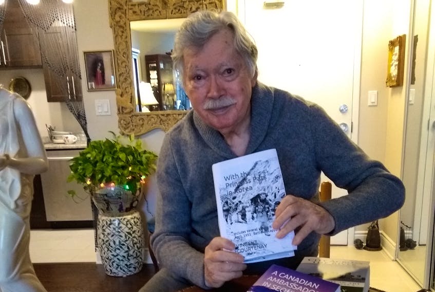 Author Vince Courtenay, shown here with one of his books, says a program that allows descendants of Korean War vets to receive free health treatment in Korea could help someone waiting a long time for care.