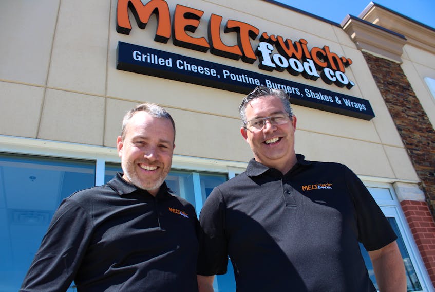 Cousins Shane MacAdam, right, and Craig MacAdam have opened the first Meltwich Food Co. franchise in Atlantic Canada. The Ontario-based grilled cheese and sandwich outlet opened in the Prince Street Plaza in Sydney on July 14.
