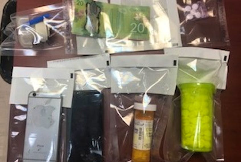 The drugs were discovered during a routine traffic stop on Shore Road. In addition to a quantity of drugs, police also seized cell phones and cash.