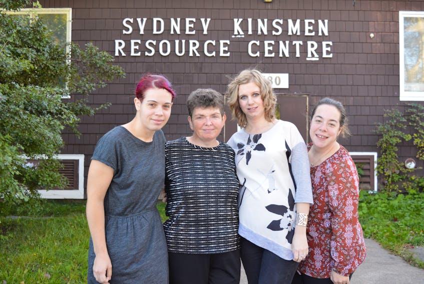Clients of the Horizon Achievement Centre in Sydney, from left, Sabrina Sanson of Westmount, Dana Farrell of Sydney, Megan Holloway, community employment counsellor for the centre, and Catlin Cox, are seen outside the Sydney Kinsmen Resource Centre, where the Horizon Achievement Centre is housed. Sharon Montgomery-Dupe/Cape Breton Post