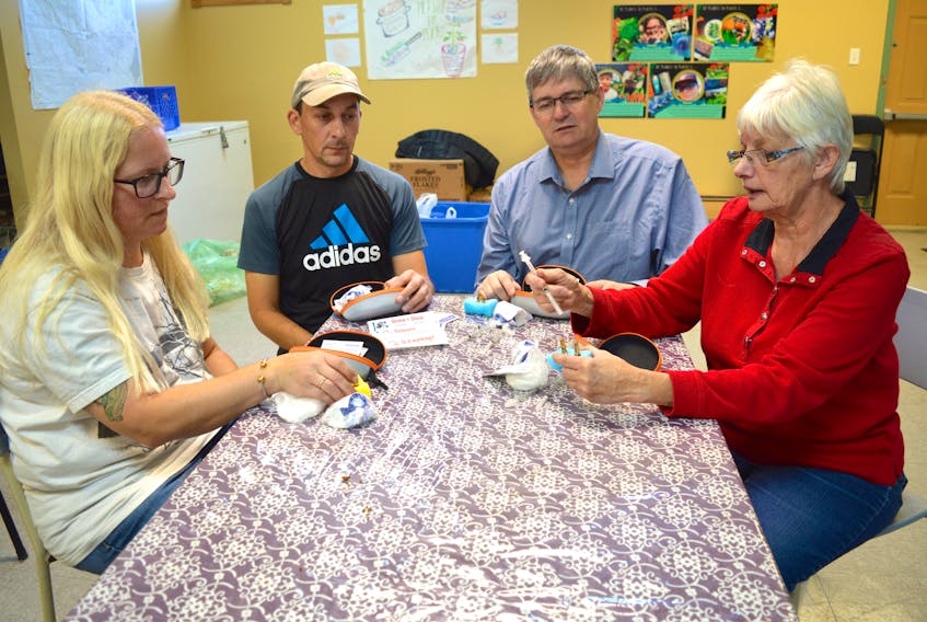 Members of the Glace Bay Food Bank were recently trained to use naloxone, a medication used to block the effects of an opioid overdose. From left are Kim McPherson, Joey Michalik, board chair Dave MacKeigan and Sandra MacPherson. Personnel from the Ally Centre of Cape Breton handled the training session. Sharon Montgomery-Dupe/Cape Breton Post
