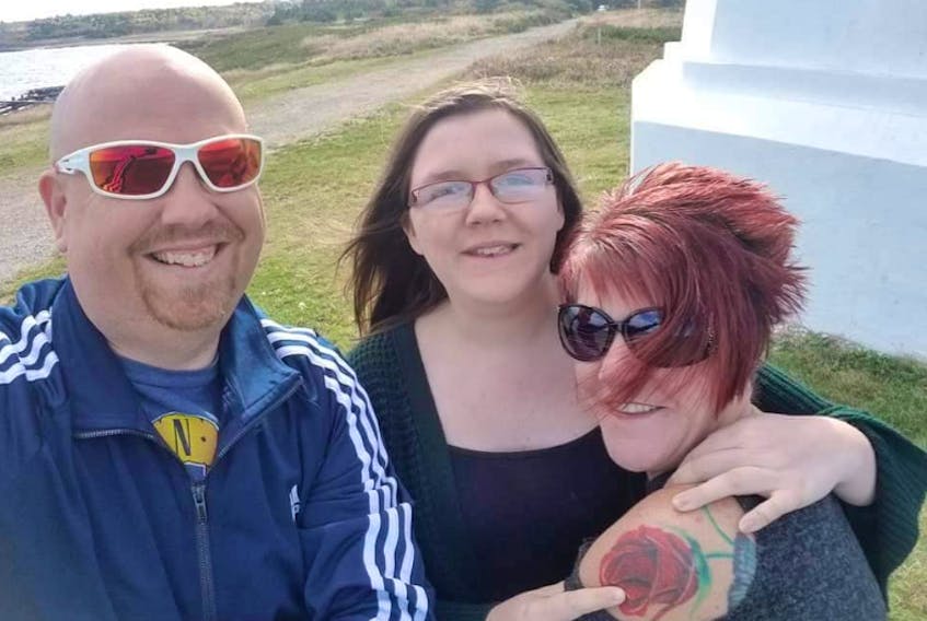From left, Shawn Rose, his daughter Alyssa Rose and his wife Lynn Rose at the Louisbourg lighthouse earlier this month. On Oct. 12, Alyssa, 13, was diagnosed with a tumour on her brain stem and had to immediately go to the IWK Hospital in Halifax. A 20-hour surgery successfully removed most of the tumour and fundraising has started to help the Sydney River family over the next few months while Alyssa recovers.
