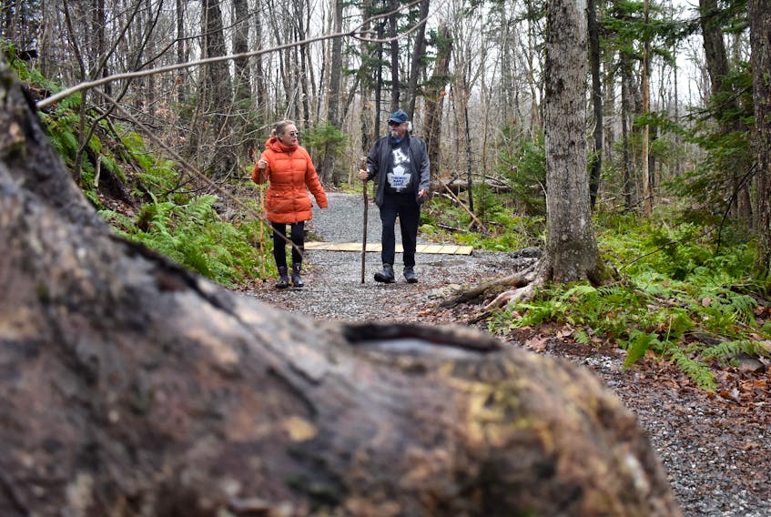 Kathryn Morrison, left, and Jinks O’Neill walk along the Baille Ard Trail in Sydney on Tuesday. Save the Baille Ard Forest, a group that is trying to save the urban nature trail and surrounding forest, has started a crowdfunding campaign so it can hire a consultant to get a second opinion on the Cape Breton Regional Municipality’s flood mitigation plans.