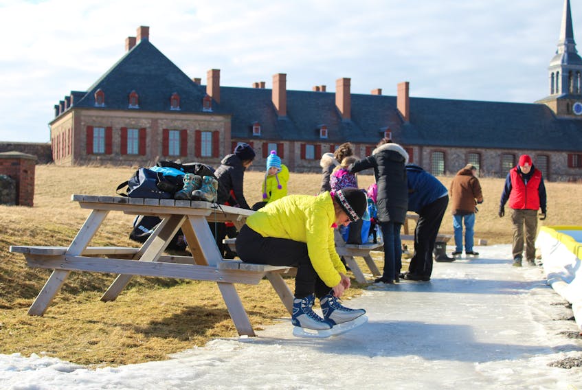 Sydney resident Diane Penny laces while getting ready to skate at the Fortress of Louisbourg in January 2019. More than 500 people took part in the free event that took place under sunny skies and in mild temperatures.
