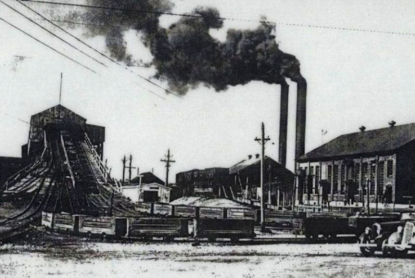 The coal cars are seen emerging from the deeps in No. 12 colliery in New Waterford. 
