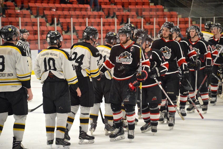 The Kameron Junior Miners, in black, and the Antigonish Bulldogs shake hands after their game at the Membertou Sport and Wellness Centre on Tuesday. The Junior Miners posted a 3-2 win in Game 5 of the series to take the best-of-seven Sid Rowe Division championship, 4-1.