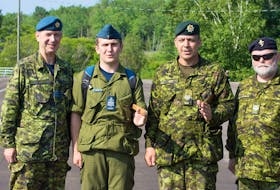 Argonaut training centre commanding officer, Lt.-Col. Bob Mackay, from left, is joined by air cadet, John Gillis of Iona, master warrant officer Brian Bell and Sgt. Jonathan Matheson during a ceremony promoting Gillis to regimental sergeant major of the Argonaut Cadet Training Centre in Oromocto, N.B.