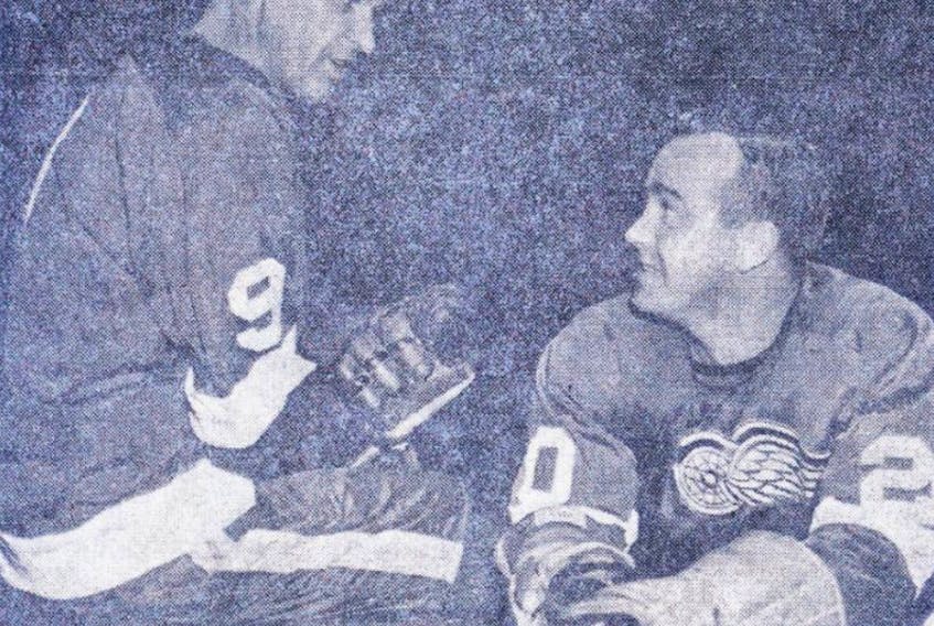 Gordie Howe, left, speaks with Parker MacDonald of Sydney in October of 1962. MacDonald played 676 games in the NHL and seven seasons with the Detroit Red Wings.
