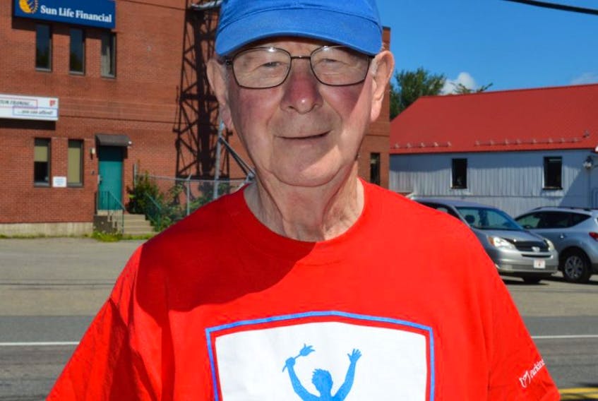 Duncan MacLeod wears his Parkinson’s SuperWalk T-shirt and a Golden K cap, two of the organizations he volunteers for despite being diagnosed with Parkinson’s six years ago.