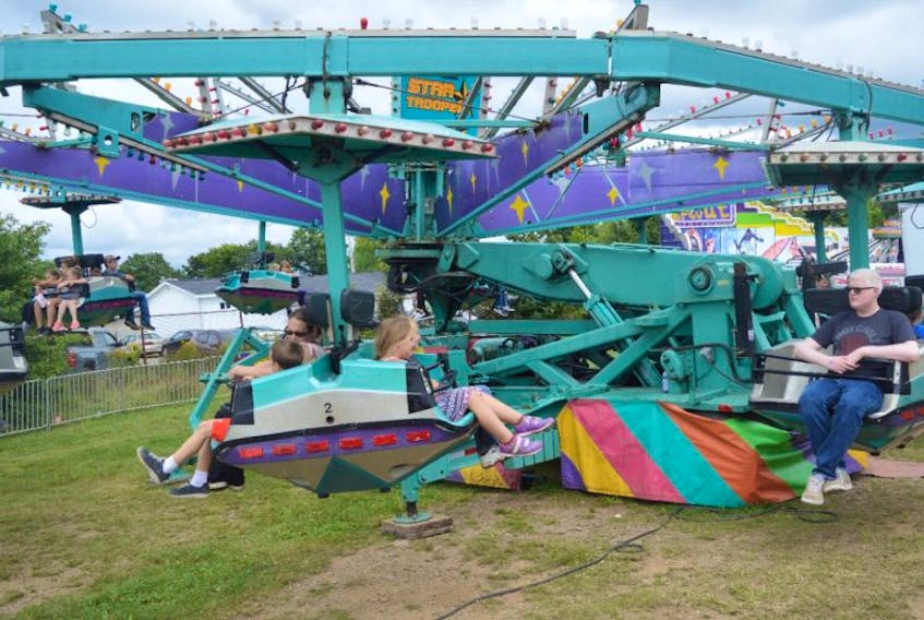 People get ready to ride the Star-Trooper at the Cape Breton County Farmers Exhibition on Saturday