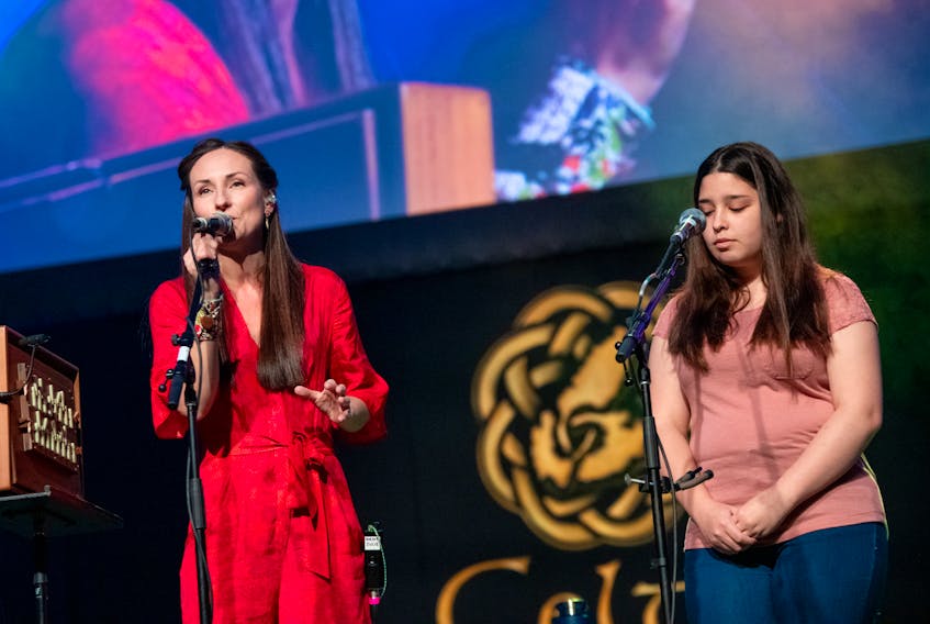 Scotland's Julie Fowlis, left, sings with Emma Stevens from Eskasoni First Nation during the Celtic Colours closing concert in Port Hawkesbury on Saturday. The Causeway Ceilidh was one of 52 official concerts held over the nine-days of the 23rd annual festival. COREY KATZ