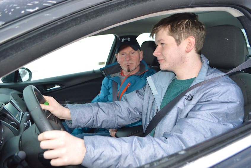 Blair Shaw, left, an instructor with the Young Drivers of Canada, goes over vehicle checks with Andrew Gouthro, 17, of Sydney, before heading out for Gouthro’s driving lesson last week. Shaw said in their program they do an entire module on safe winter driving. The Cape Breton Regional Police Service say the biggest hazard in a snowstorm is vehicles on the road.
