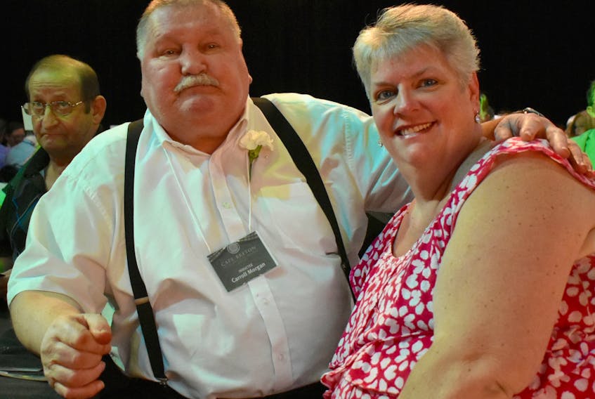 Carroll Morgan, left, and his wife Marlene Morgan poise for a photo during the annual Cape Breton Sports Hall of Fame at Centre 200 in Sydney on June 1. The Whiteside, Richmond County, boxer who represented Canada at the 1972 Olympic died Wednesday at age 70.