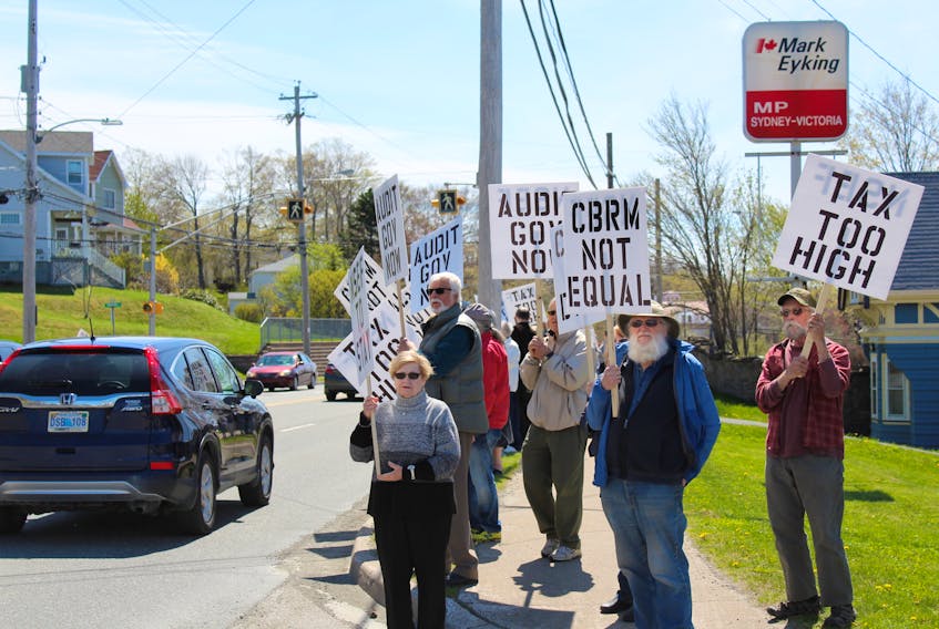 About 200 protesters took to the street along Kings Road in front of Cabot House Tuesday afternoon, calling for action from the provincial and federal governments in giving Cape Breton a better share of equalization funding.