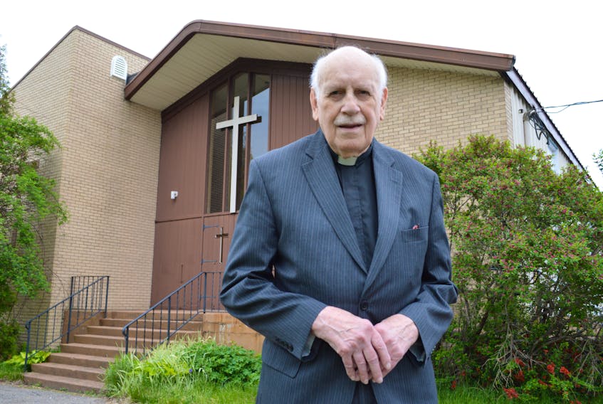 Rev. Donald MacDonald of Newsom United Church on Dominion Street in Glace Bay stands outside the church. MacDonald, who turns 90 in August, said although he has officially retired numerous times, this time it will be permanent.
