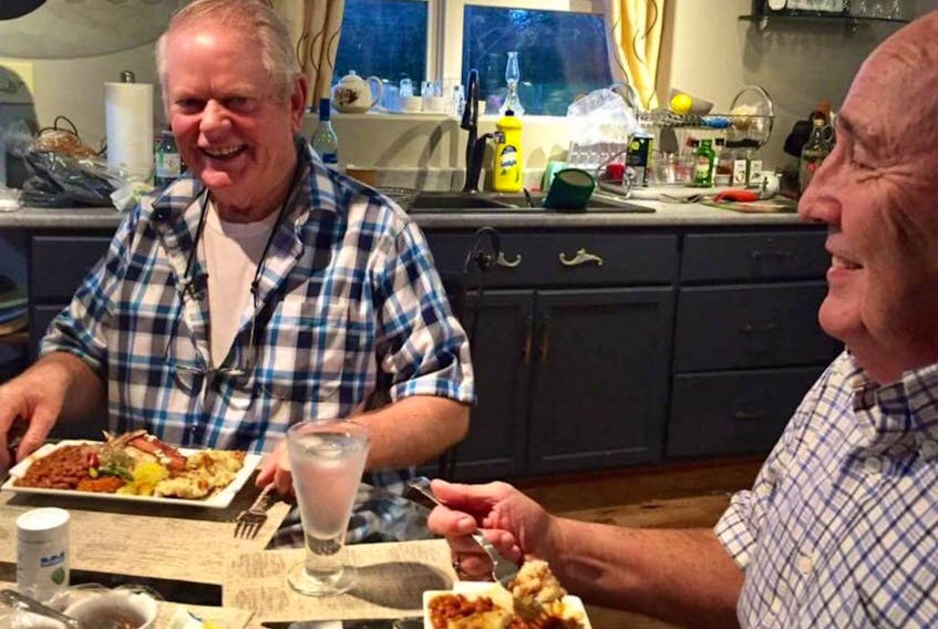 Louisbourg Seafoods vice-president of sustainability Dannie Hanson loved to cook for friends at the family farm in Mira. Hanson, left, is accompanied by friend and his former Cape Breton Regional Municipality council colleague, Ivan Doncaster, in this photo taken in 2016. Family, friends and colleagues are mourning Hanson’s sudden death on Thursday.