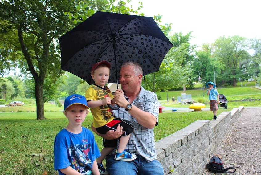 Thursday’s was grandpa’s day at the park with his grandkids at Wentworth Park in Sydney. The family members are shown gathered under an umbrella while taking a break from play. From the left are Easton Cameron, Clark Cameron, Bill Moore, their grandfather, and Seth Cameron. The boy’s sister as well as their grandmother had joined them in the park before heading back to their Sydney home must prior to this photo being taken.