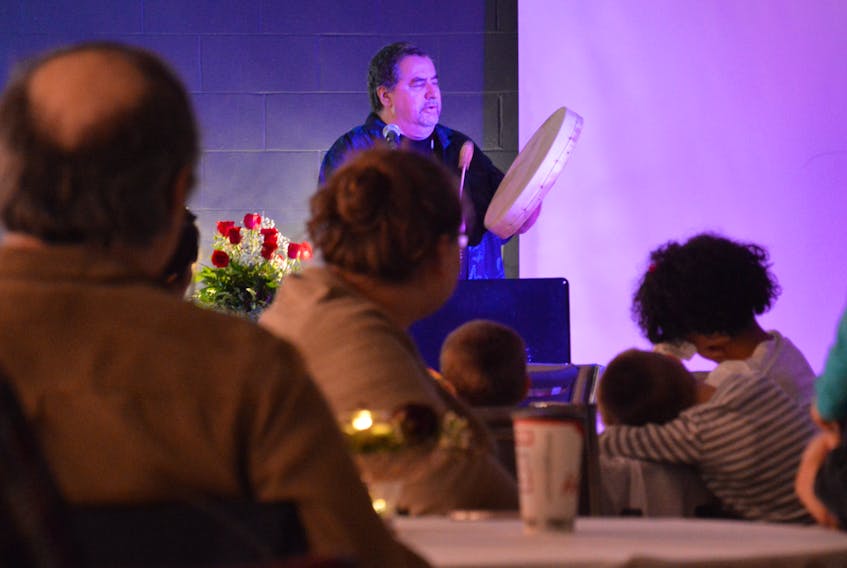 Andrew Paul from Potlotek (Chapel Island) performs the honour song at one of the Light of Light festival events for the Baha’i faith on Sunday at Étoile de l’Acadie. (Nikki Sullivan/Cape Breton Post)