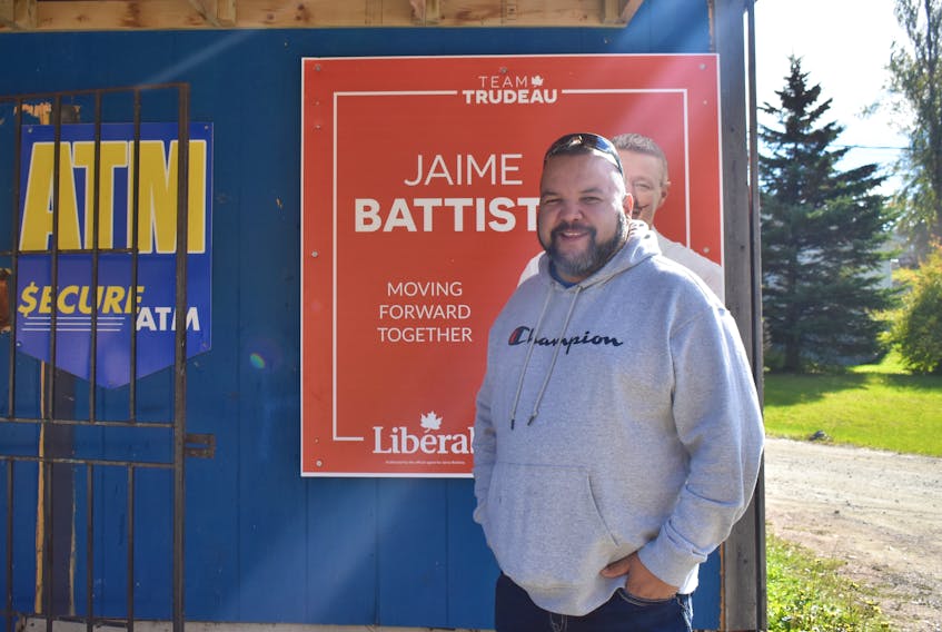 Eskasoni resident Noel Denny stands in front of a Jaime Battiste campaign sign outside the convenience store where Denny works. Denny said members of the Cape Breton First Nations community are pleased with the election of Battiste as Canada’s first Mi’kmaq Member of Parliament.