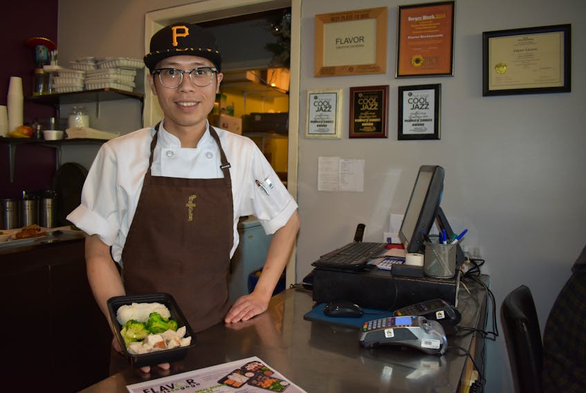 Chef Seung Hyun Park at Flavor Downtown shows off one of their new Meals to Go Go items. Nikki Sullivan/Cape Breton Post