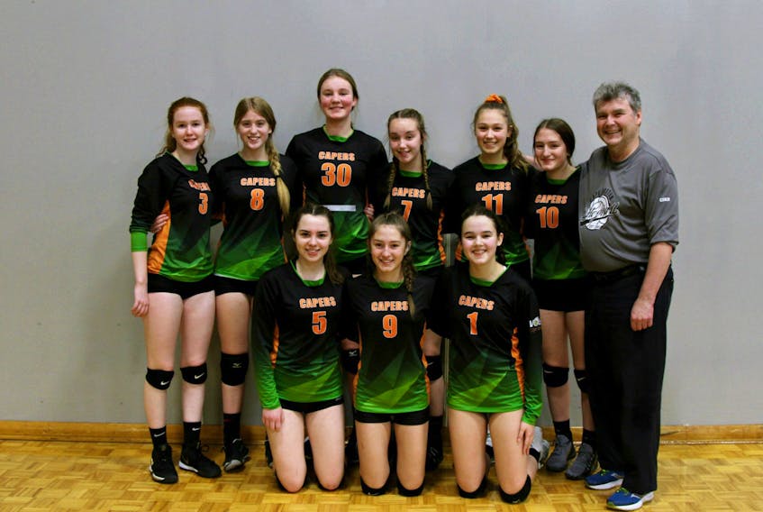 David MacIsaac poses for a team picture with members of Volleyball Cape Breton’s under-16 team.