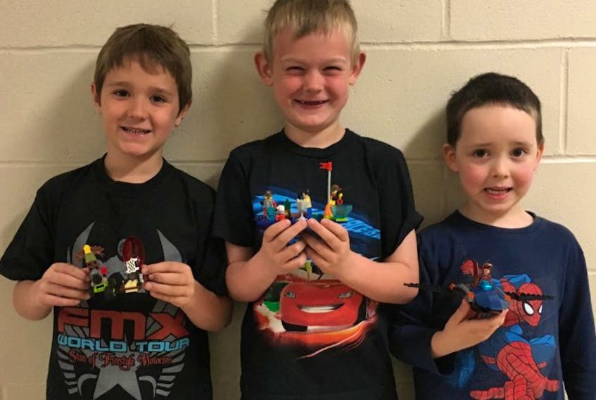 Lego fans include these students, from left to right, Micah O'Brien, Cohen MacDonald, and Riley MacDonald.