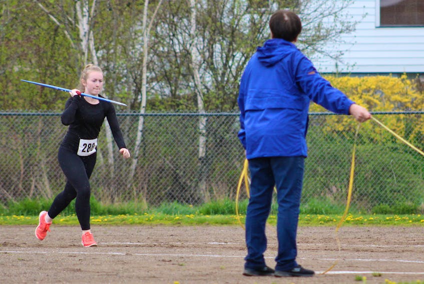 Taylor Coleman from Riverview Rural High School starts her run before making her throw during the senior girls javelin event at the Cape Breton-Victoria district track and field championships on Wednesday.