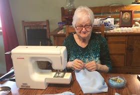 Pat MacIntyre, president of the Quarry Point Quilt Guild, sews sleeves in her Glace Bay home last month. The sleeves were then attached to short-sleeve resident gowns, turning them into isolation gowns for Seaview Manor. Seaview Manor CEO Eric Doucette came up with the idea to modify some of their current supply of gowns to make 155 isolation gowns, which can be washed on site, in case residents contracted COVID-19, after finding it difficult to buy them.